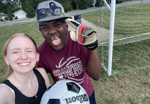 DSP with a young person playing soccer